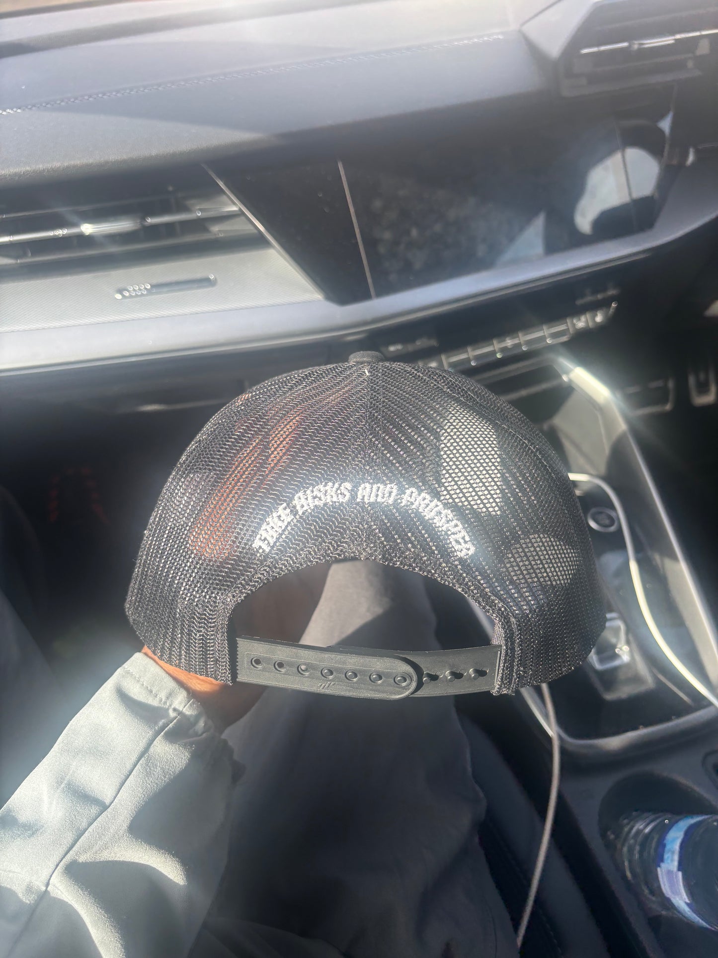 black and white REVALT “TAKE RISKS AND PROSPER” cap