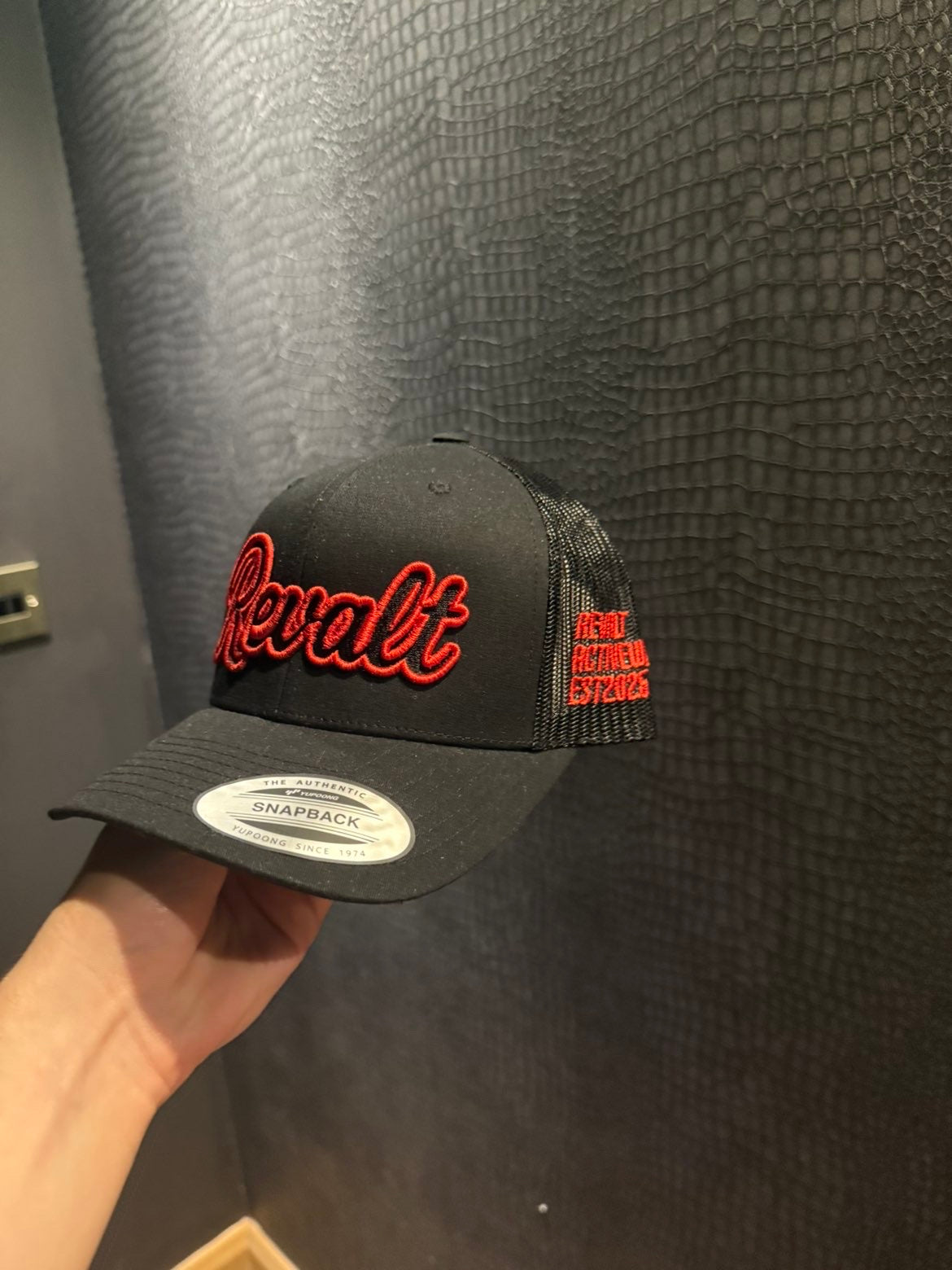 Revalt “consistency is key” red and black cap
