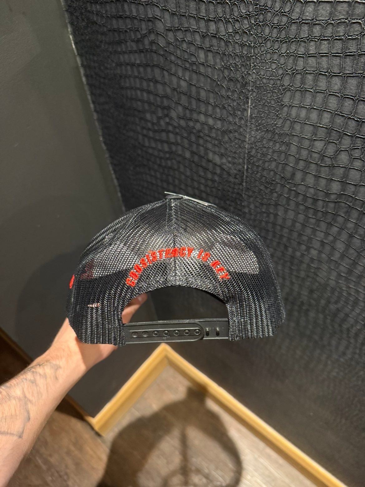 Revalt “consistency is key” red and black cap